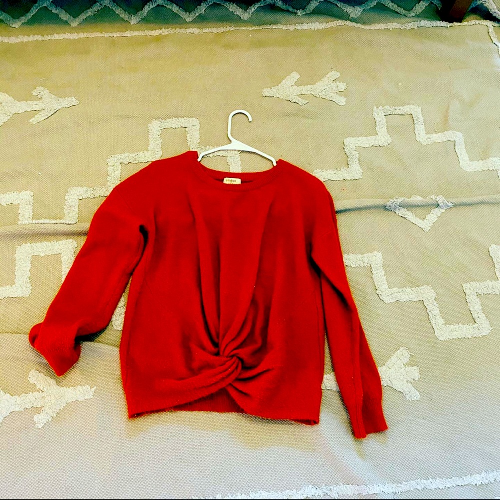 Red sweater with knot at end
